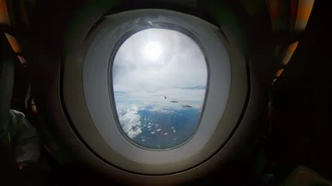 Airplane window seat with nice sky, clouds view. Looking out the window of .. Stock Footage 293774695