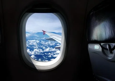 Airplane window seat with view Stock Photos