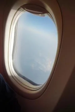 Airplane window a shoft clouds 写真素材