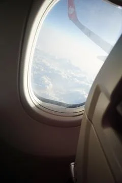 Airplane window a shoft clouds Фото
