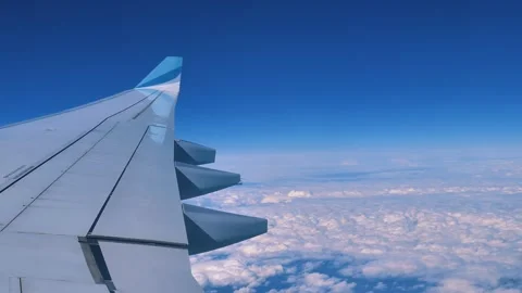 Airplane window showing the wing in flight Stock Footage 315593781