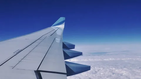 Airplane window showing the wing in flight Stock Footage 315593782