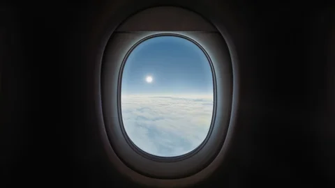 Airplane Window View, Above the Clouds, Blue Sky Video stock 115700663