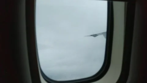 Airplane Window View Above the dramatic overcast sky. Stock Footage 274460935