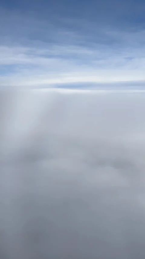 Airplane Window View Blue Sky Above the Clouds UGC video Stock Footage 306660750