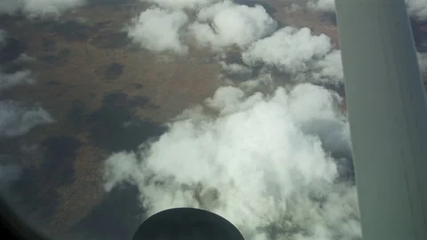Airplane Window View with Clouds over Savannah Stock Footage 316978422