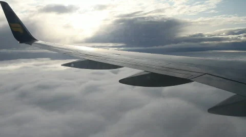 Airplane window view of clouds from passenger seat Stock Footage 543769