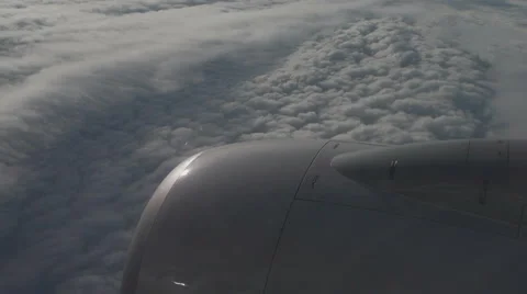 Airplane window view of clouds from passenger seat Vídeo Stock 40658864