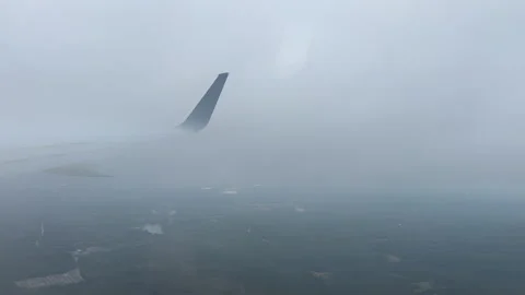 Airplane Window View Cloudy Dense Clouds Flight Plane Blue Wing Stock Footage 319593075