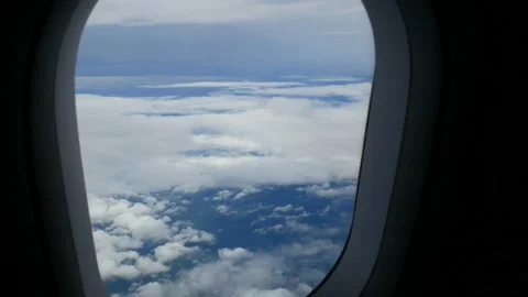 Airplane window view fly over cloud. passenger aircraft aviation airline flying. Stock Footage 135405709