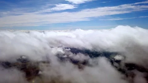 Airplane Window View Flying above a sea of clouds over Gran Canaria, Spain Stock Footage 346477762