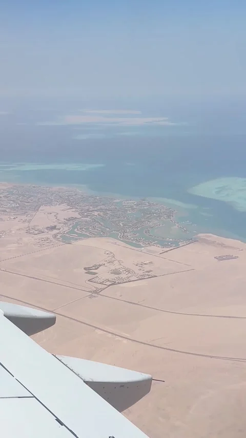 Airplane window view flying over egypt's coastline Stock-Footage 331847949