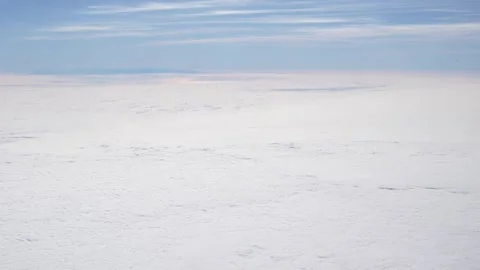 Airplane window view flying over a sea of clouds Stock Footage 339353798