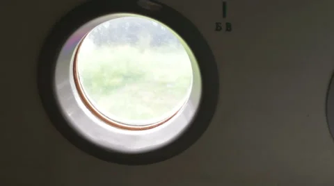 Airplane window view from the inside Stock Footage 65565659