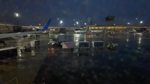 Airplane window view out to Newark Liberty International Airport, NJ - 4K Stock Footage 310849364