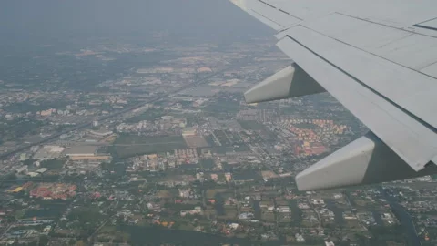 Airplane window view over bangkok area Stock Footage 333103235
