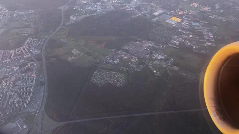 Airplane Window View Over City and Fields at Sunset Concept of Transition Stock-Footage 336461887