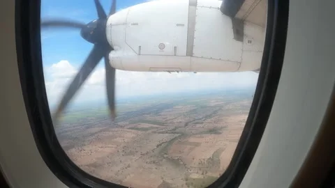 Airplane Window View Over Fields in Laos Stock Footage 348173328