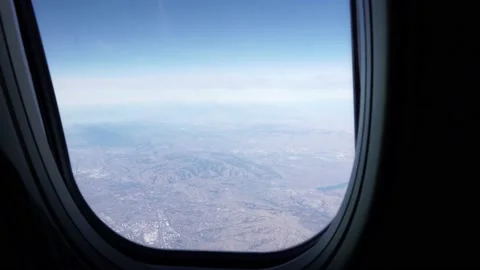 Airplane Window View Overlooking Sierra Nevada Mountain Stock Footage 146154134
