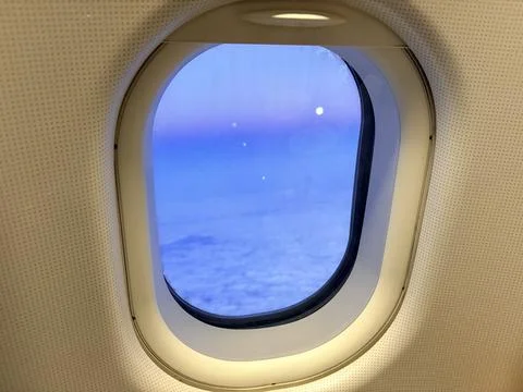 Airplane window view of a starry night sky. Stock-Fotos