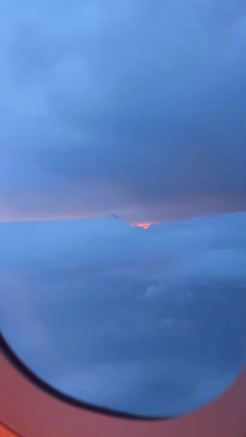 Airplane Window View of Sunset Clouds Video stock 341317661