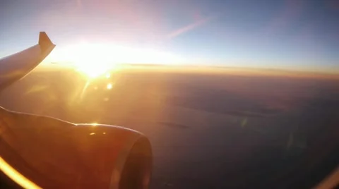 Airplane window view at sunset Stock Footage 22096057