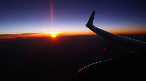 Airplane window view at sunset sunrise passenger aircraft aviation airline Stock Footage 59798831