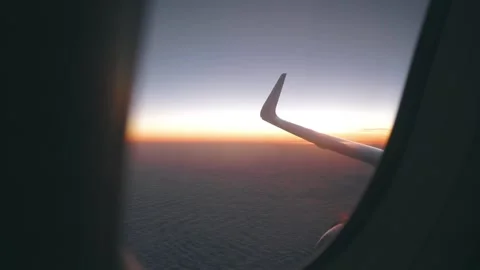Airplane window view at sunset sunrise Stock Footage 123333707