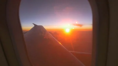 Airplane window view at sunset, Zoom shot Stock Footage 49677877