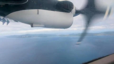 Airplane window view of tropical island Kadavu in Fiji, South Pacific over 스톡 동영상 345052959