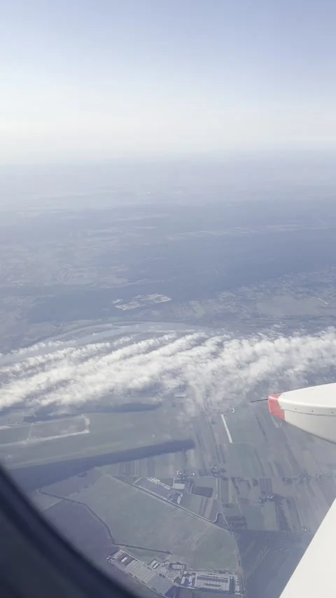 Airplane window view- UK Stock Footage 291185077