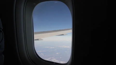 Airplane Window View, WING , Above Clouds, Flying Stock Footage 47567512