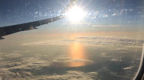 Airplane Window View, Wing , Above Clouds, Flying Stock Footage 47567691
