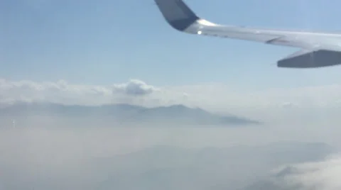 Airplane Window View,  Wing Above Clouds, Flying Stock Footage 48923687