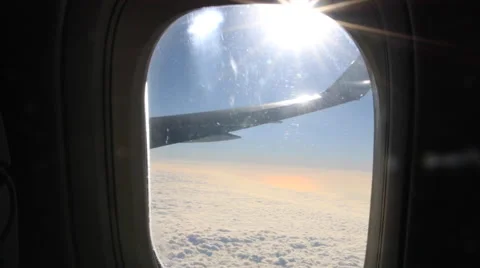 Airplane Window View, Zoom in, Above Clouds, Wing, Flying Stock Footage 47567057
