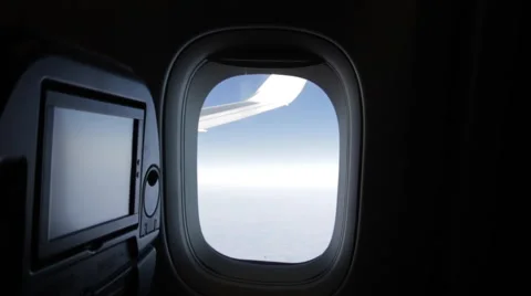 Airplane Window View, Zoom in Above Clouds, Flying, WIng Stock Footage 47567804