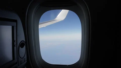 Airplane Window View, Zooms into Window, Earth below, Wing Stock Footage 47567527