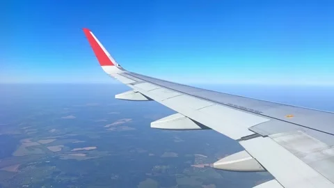 Airplane windows view above the earth on landmark down. View from an airplane  Stock Footage 305591902