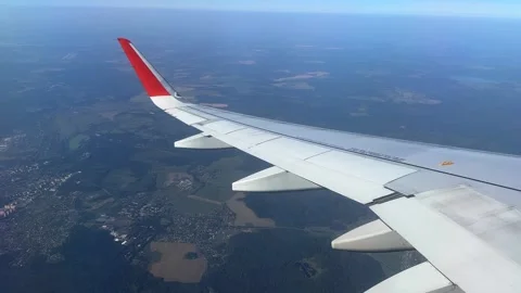 Airplane windows view above the earth on landmark down. View from an airplane  Stock Footage 305592414