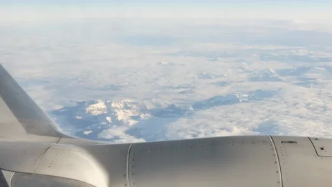 Airplane wing above the clouds - Closeup Stock Footage 115112155