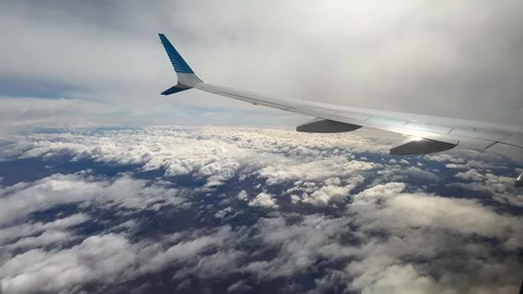 Airplane Wing Above Clouds During Flight Over Tierra del Fuego, Argentina Stock Footage 339433671