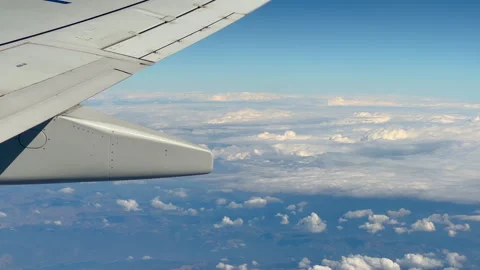 Airplane wing above clouds during flight in Turkey - close up Stock Footage 346537241