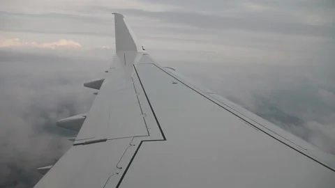 Airplane wing above the clouds Stock Footage 154567135