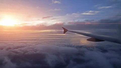Airplane Wing Above Clouds at Sunset Aerial View 스톡 동영상 310324683