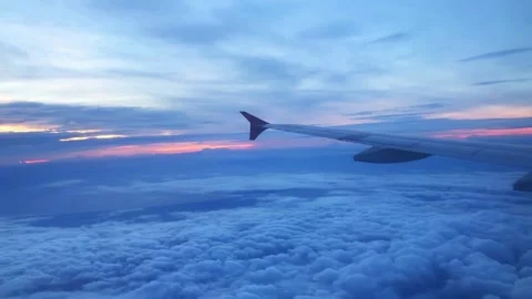 Airplane Wing Above Clouds at Sunset, Aerial View Video stock 310375092