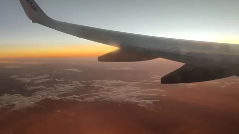 Airplane Wing Above Clouds at Sunset, Aerial View (15 Sept 2026) Stock-Footage 345587569