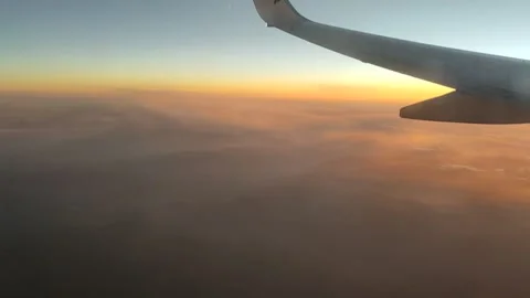 Airplane Wing Above Clouds at Sunset, Aerial View (15 Sept 2026) Stock-Footage 345587600
