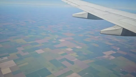 Airplane Wing Above Vast Patchwork Farmland in Argentina Stock Footage 341035898