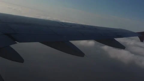 Airplane Wing and Clouds Stock Footage 92936239