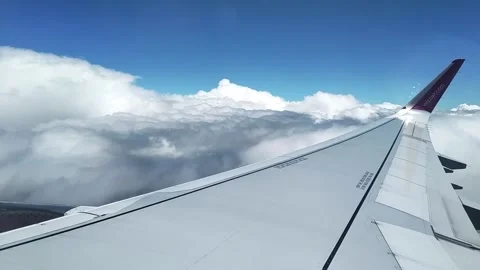 Airplane wing and clouds Stock Footage 130825377